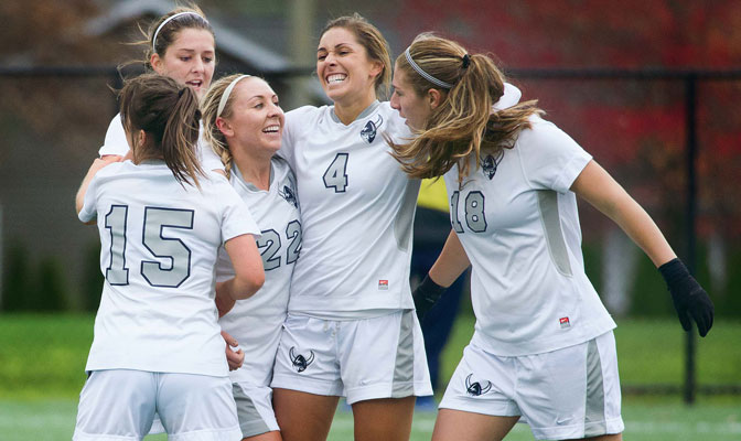 Western Washington players embrace Stephanie Hamilton (22) after her game-winning goal against SPU in the second round of the Division II West Region Playoffs.